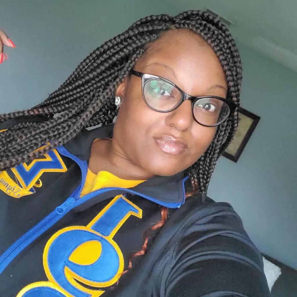 Client wearing long black box braids with clean parts — Box Braids