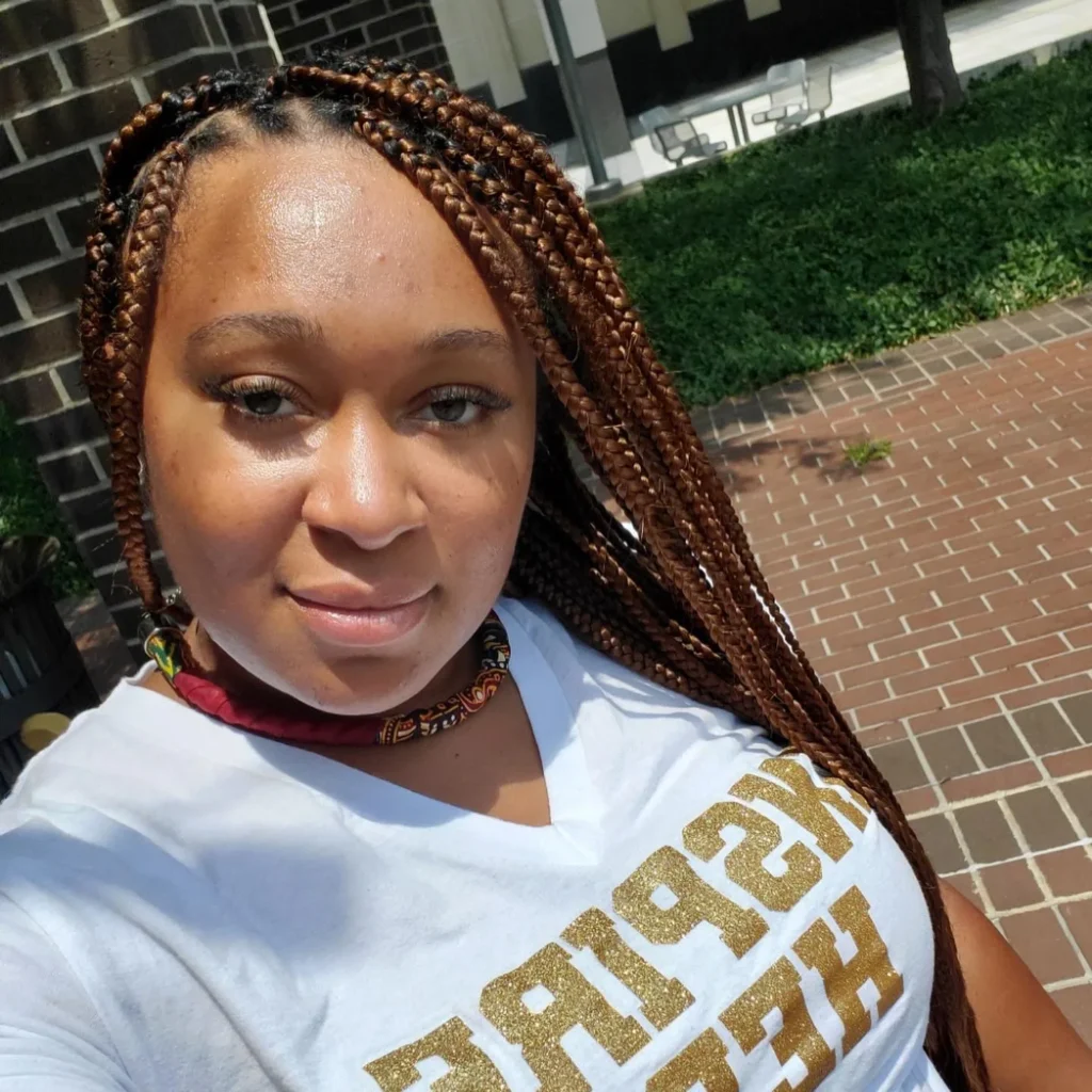 Client outdoors with long auburn knotless braids — Knotless Braids