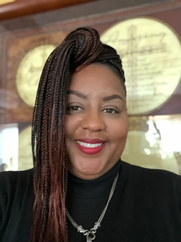 Smiling client with a side-swept miracle knots style — Miracle Knots